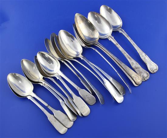 Nine assorted 19th century silver table spoons and eight silver dessert spoons, 30.5 oz.